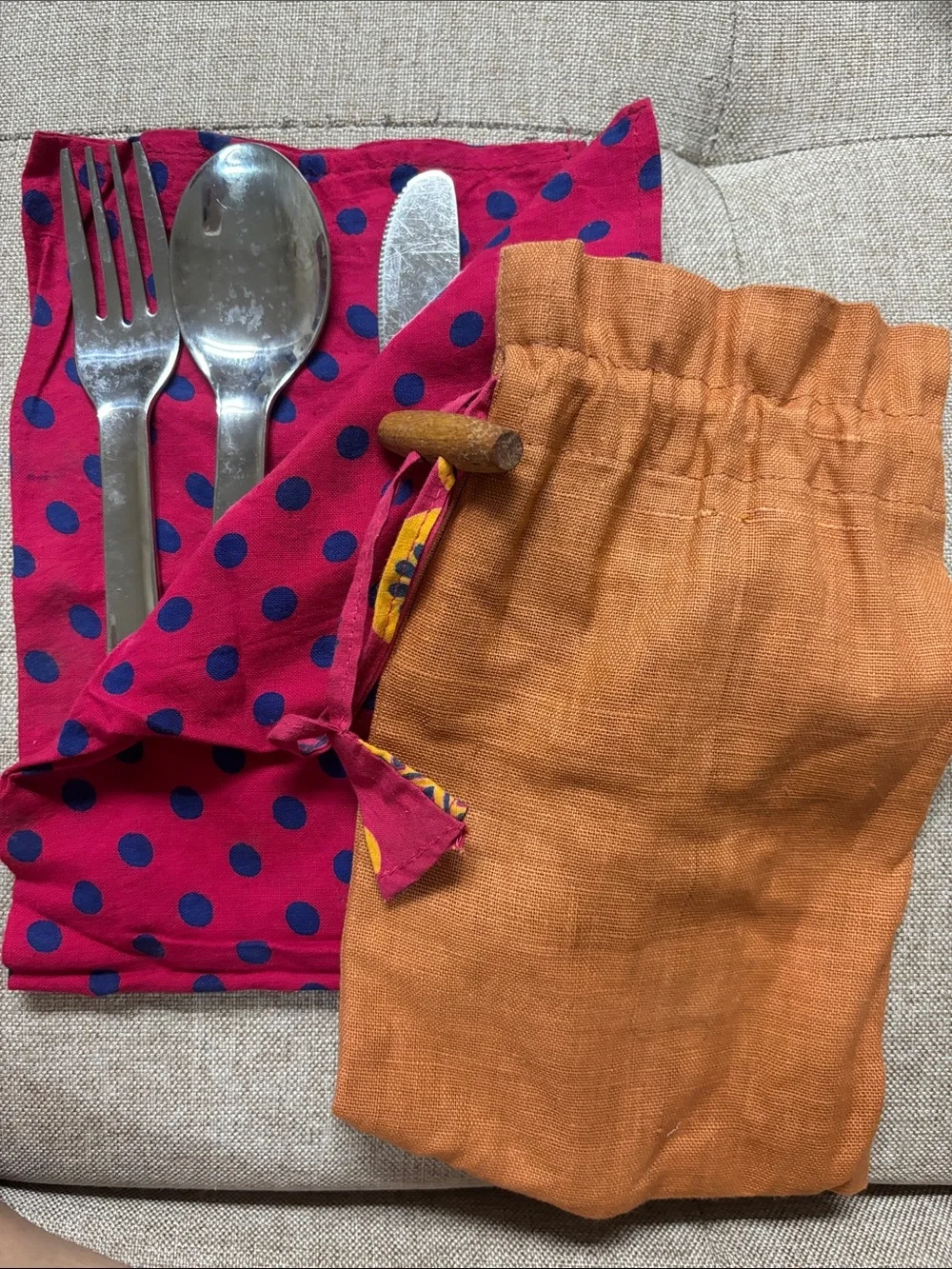 Stainless steel set(fork, spoon, knife) and napkin.